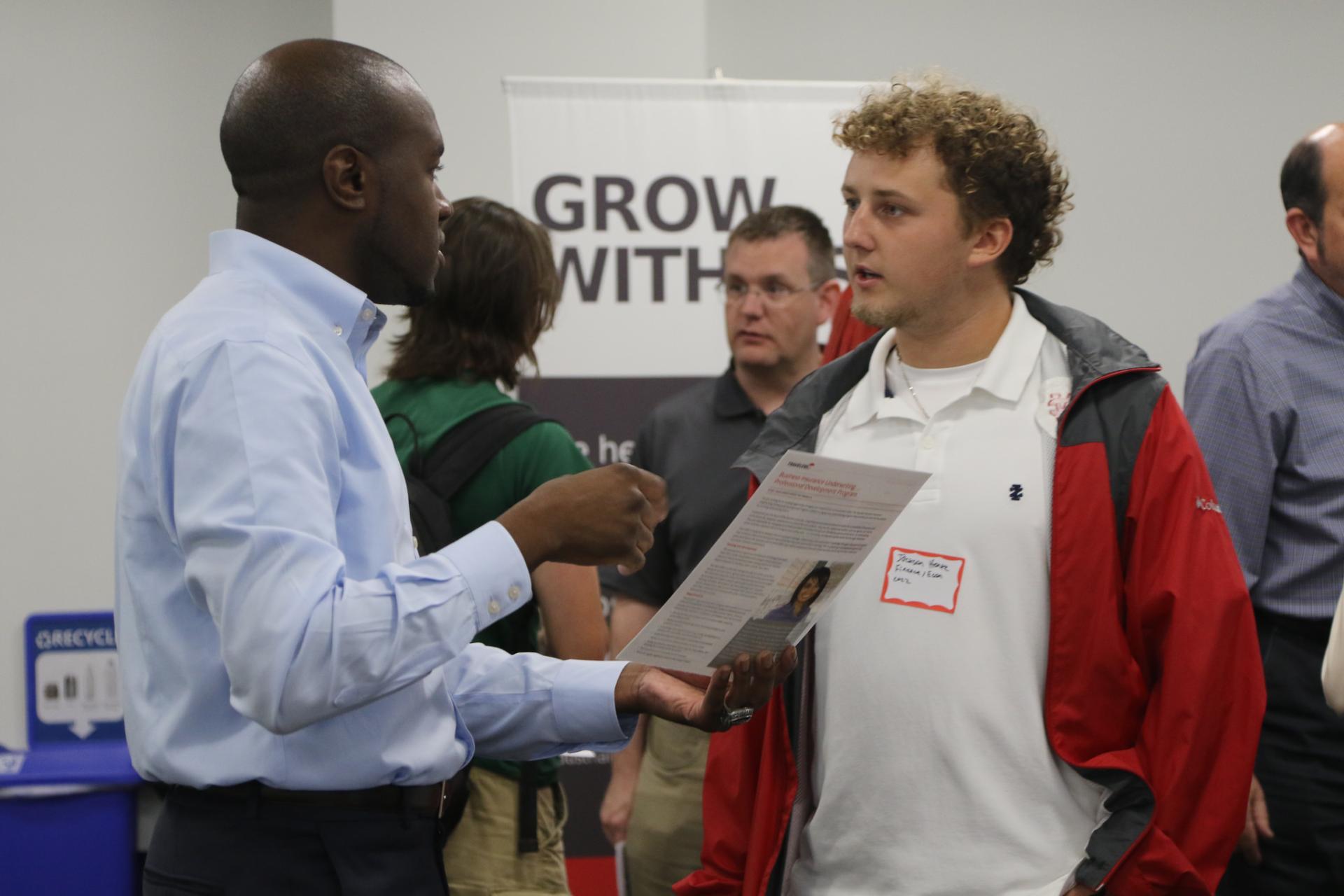 A student meets with a potential employer at the employer meet and greet held at North Central College.