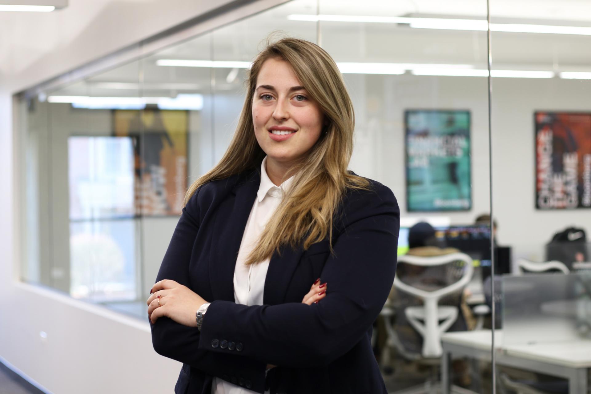 North Central College student Alice Zordan poses in the suit she received from the Cardinal Career Closet support program.