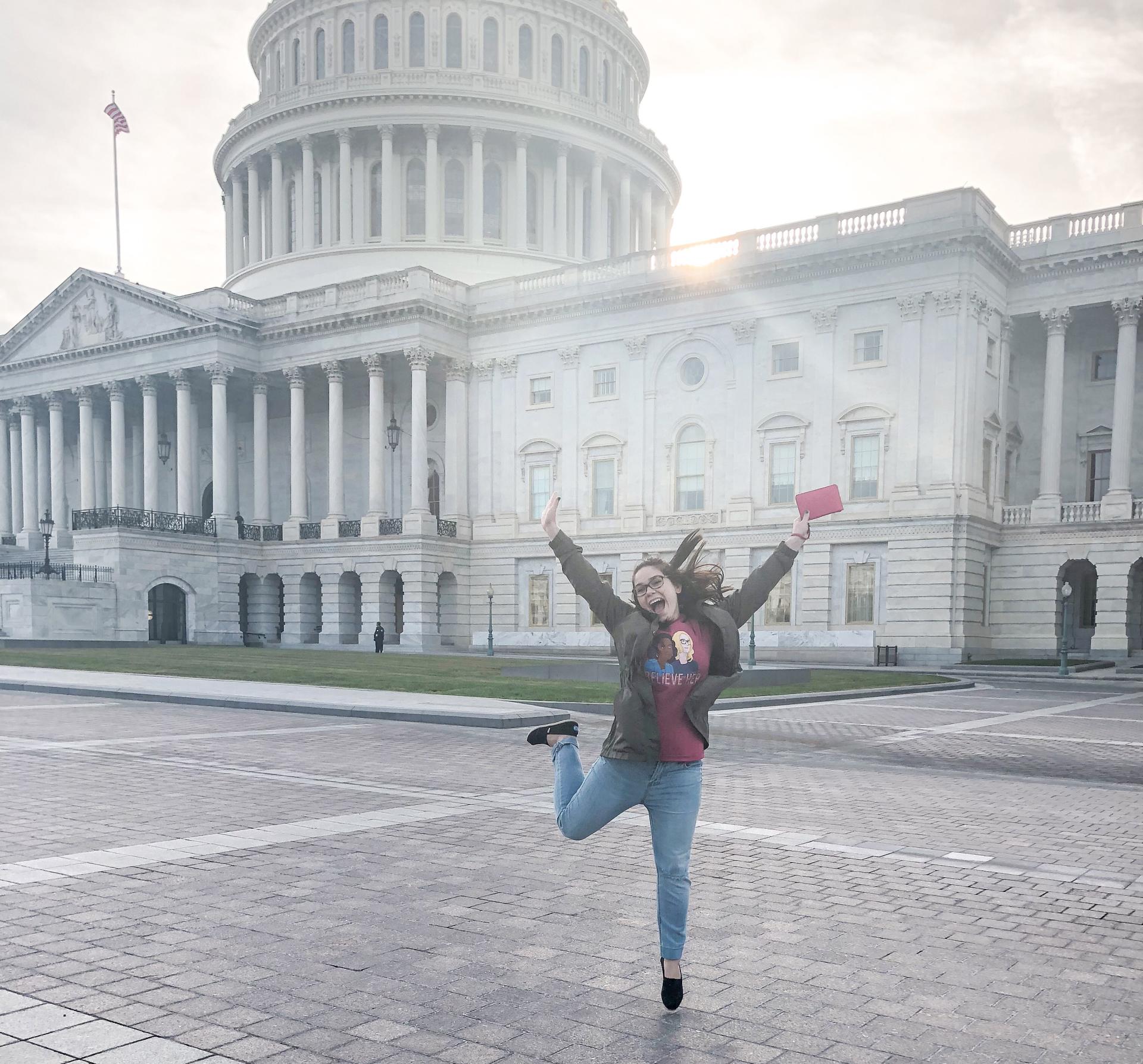 Katie Costenaro '19 poses mid-flight with the United States Capital Building