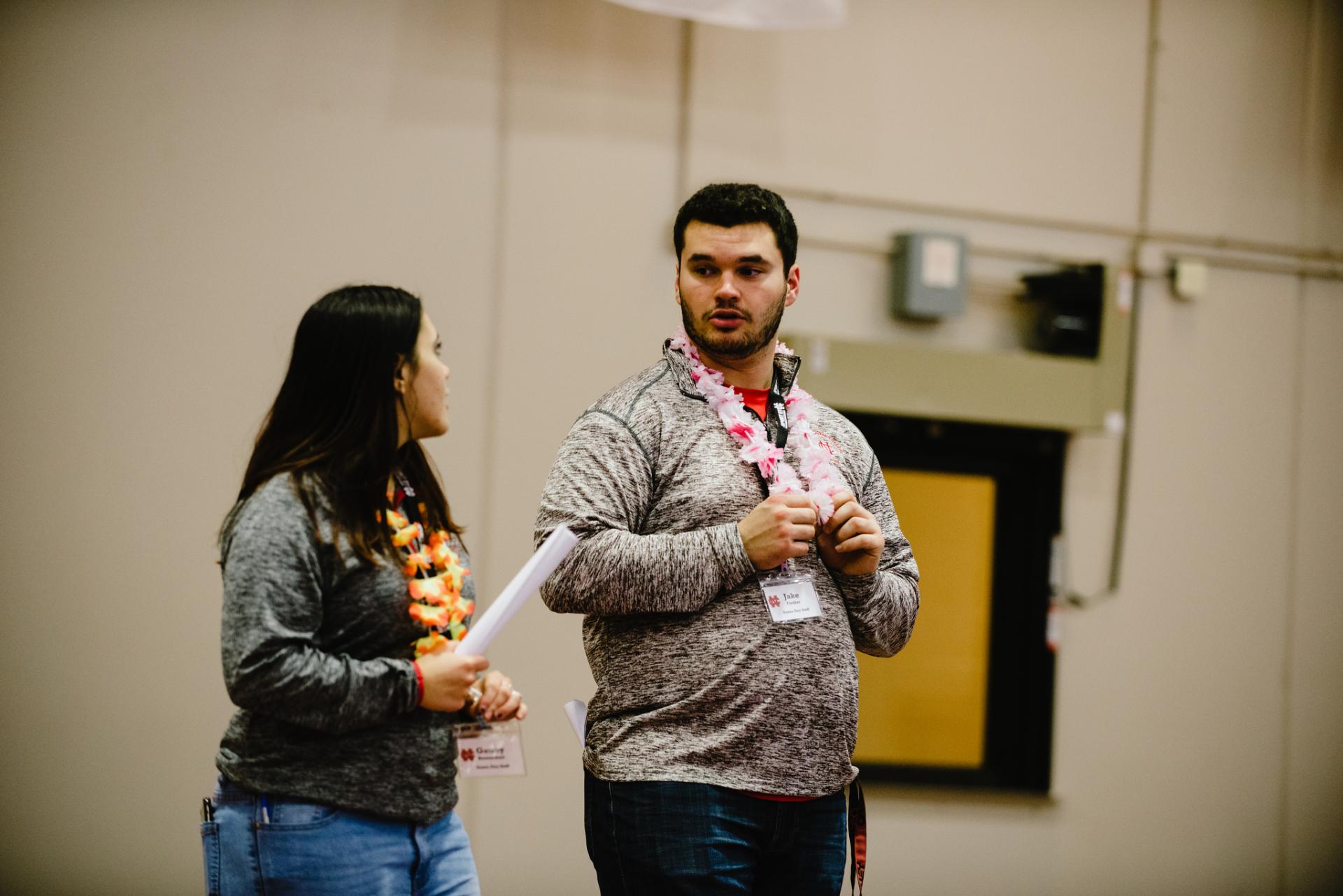 Sport management students Genny Bernardoni and Jake Fiedler discuss in-game entertainment ideas.