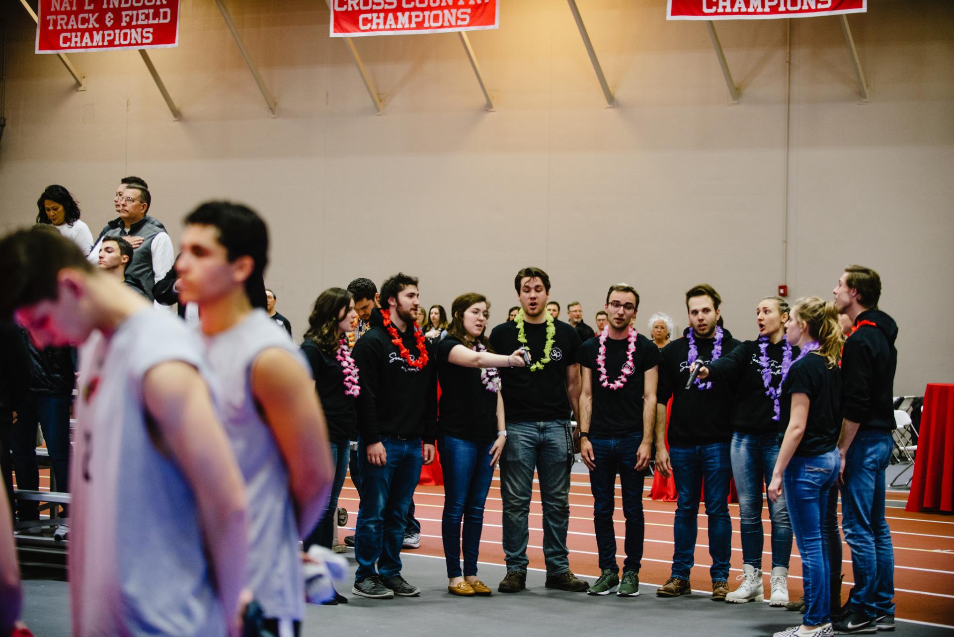 Sonata Problem, North Central's original a capella singing group, performs The Star Spangled Banner. Sport management students arranged to have them perform.