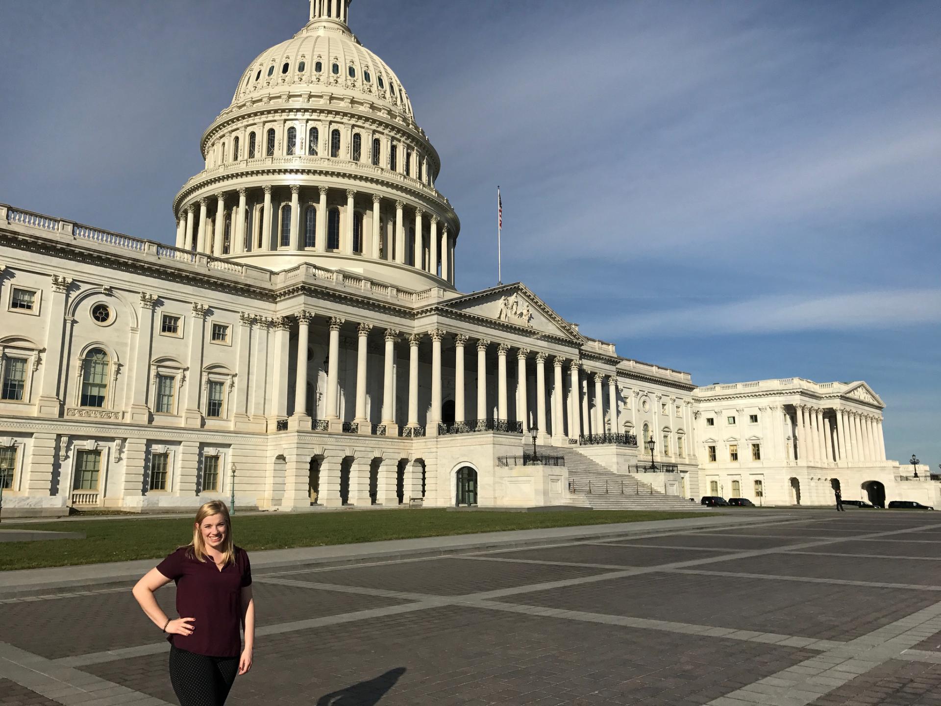 North Central College alumna Ashley Clayton standing in front of the U.S. Capitol.