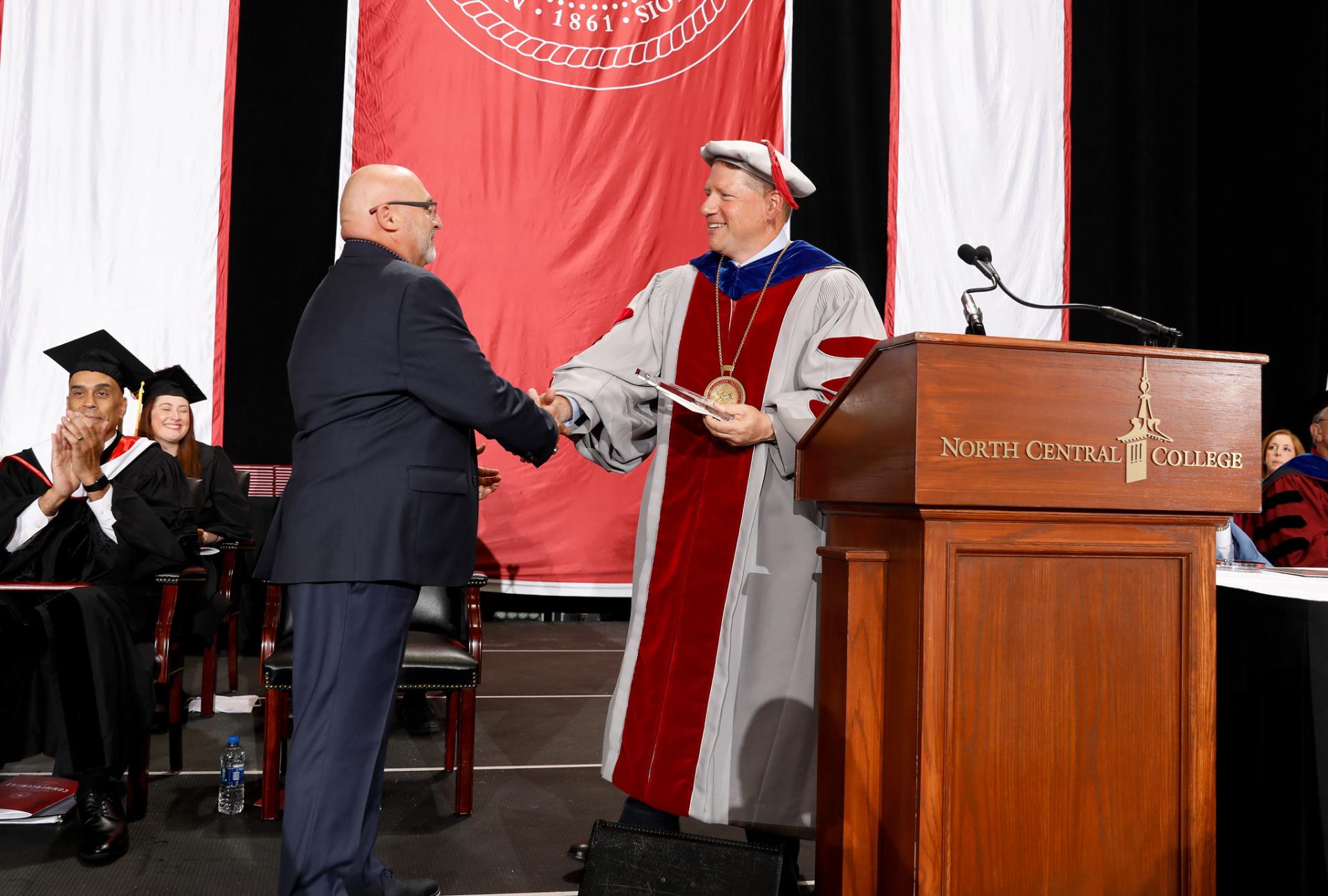 North Central College White Award winner Frank Gramarosso with President Troy Hammond.