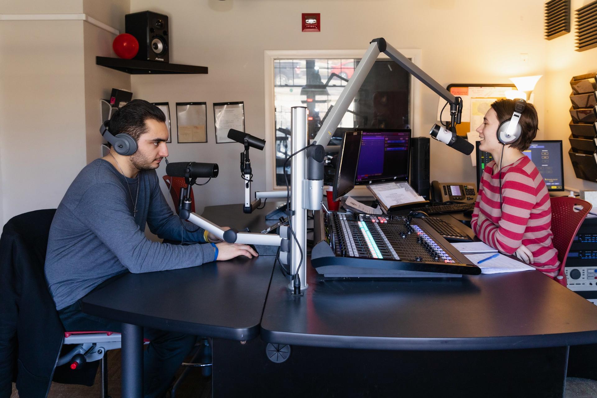 North Central College students using the new console at WONC during a broadcast.