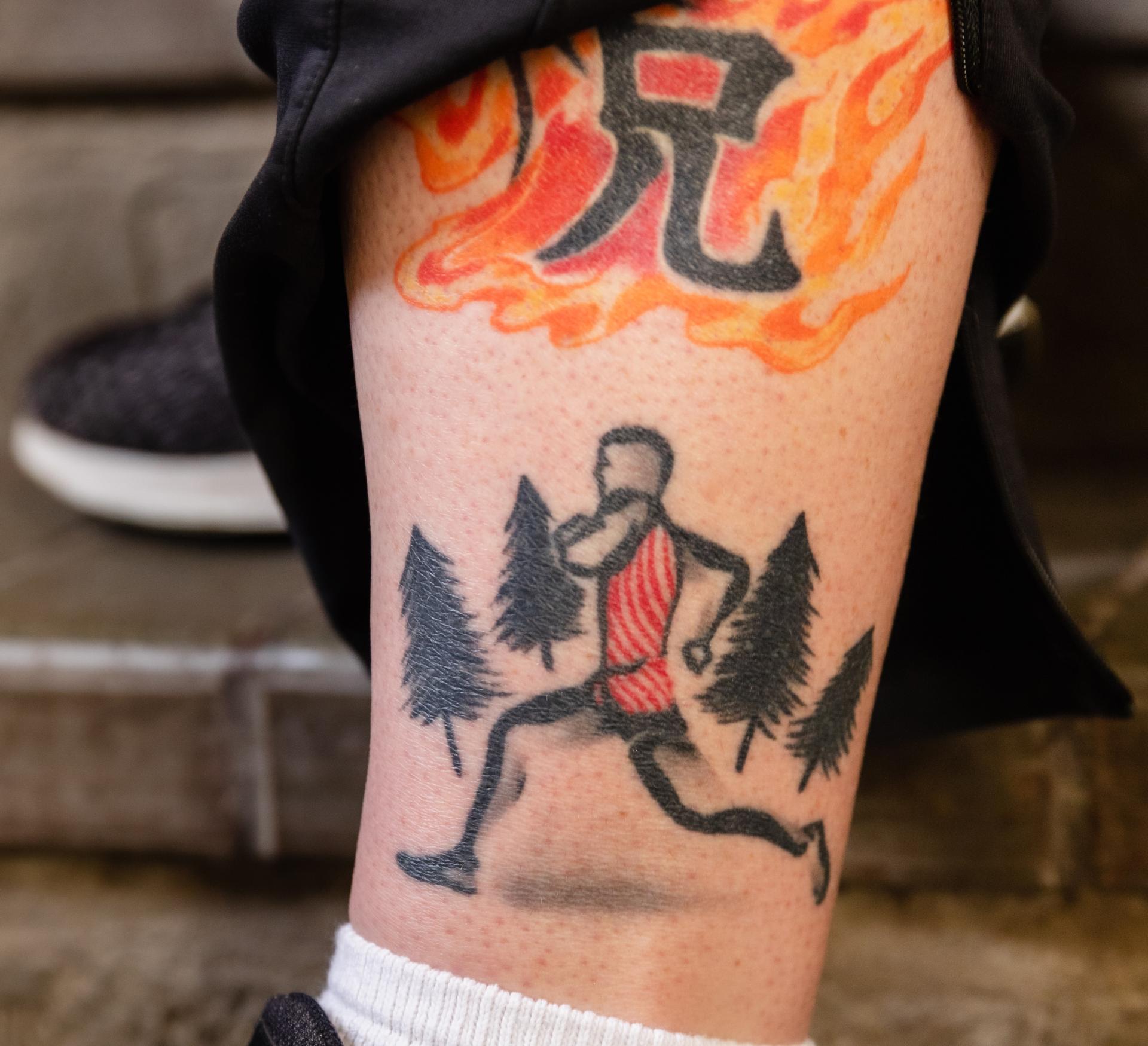 Matt Sinnott's runner silhouette tattoo.