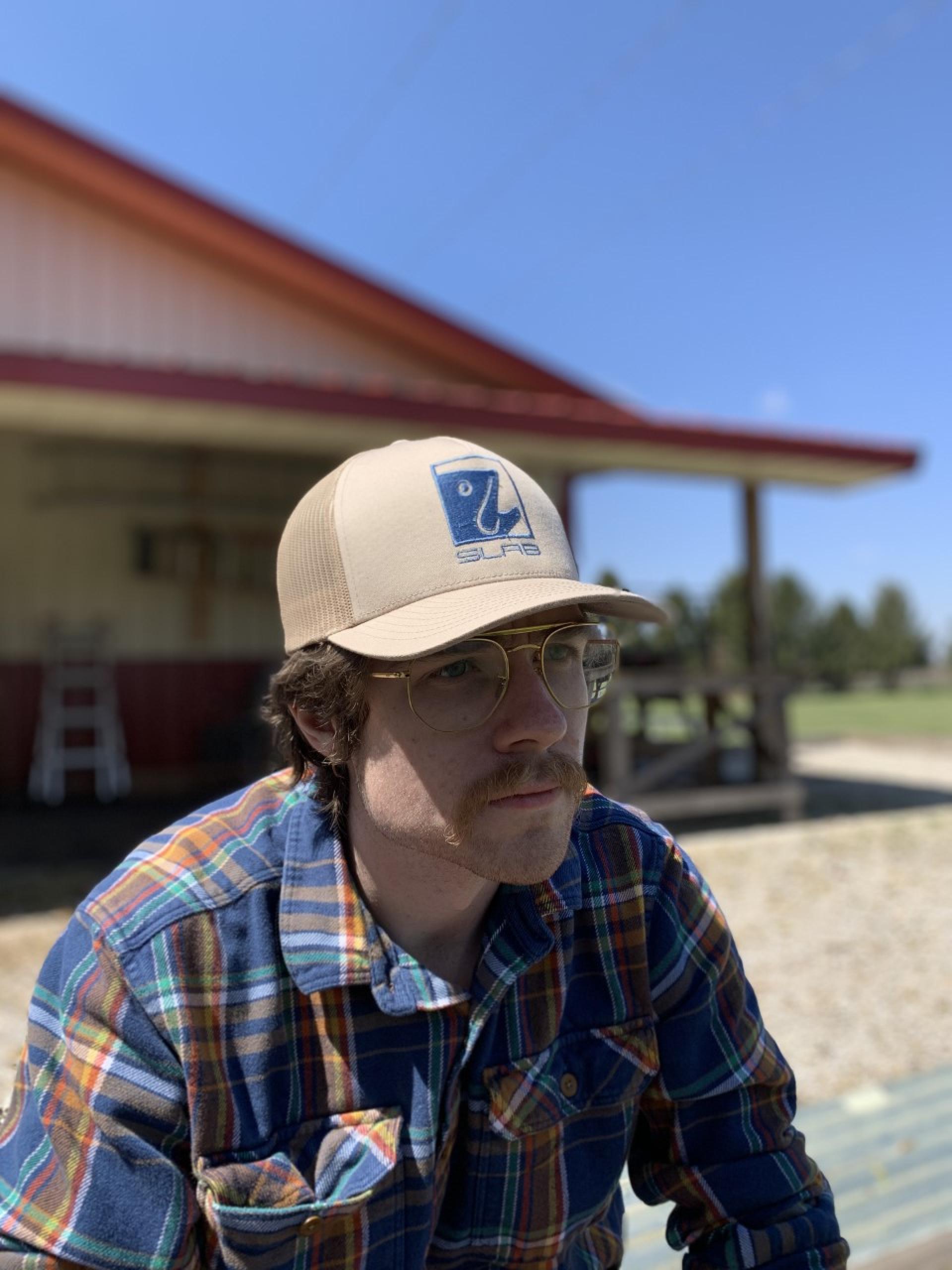 Tyler Jones' brother Ryan models a SLAB Outdoors hat.