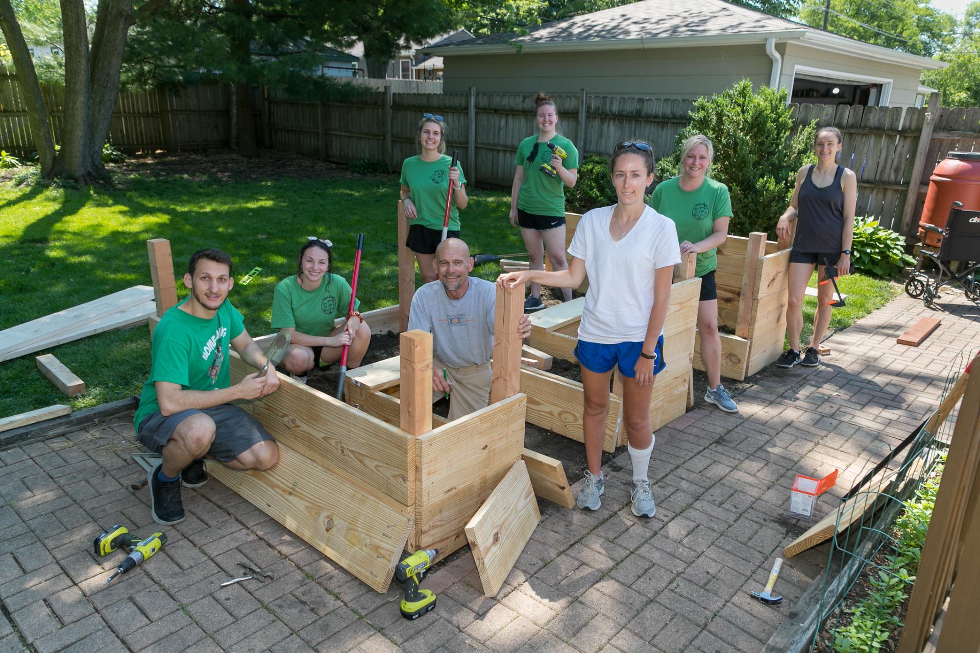North Central College occupational therapy students working on their raised garden project.
