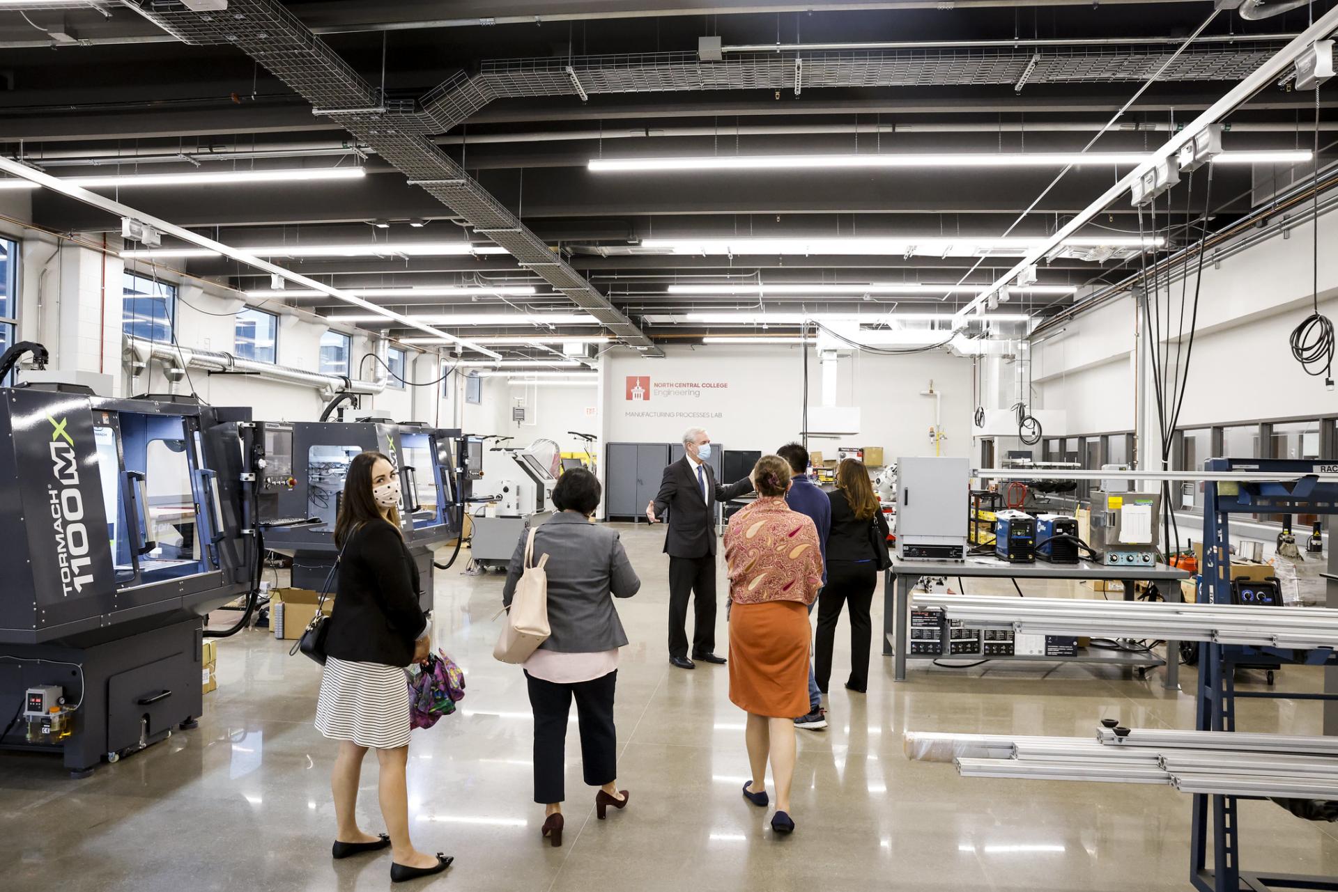 The Manufacturing Processes Lab is shown to a tour group.