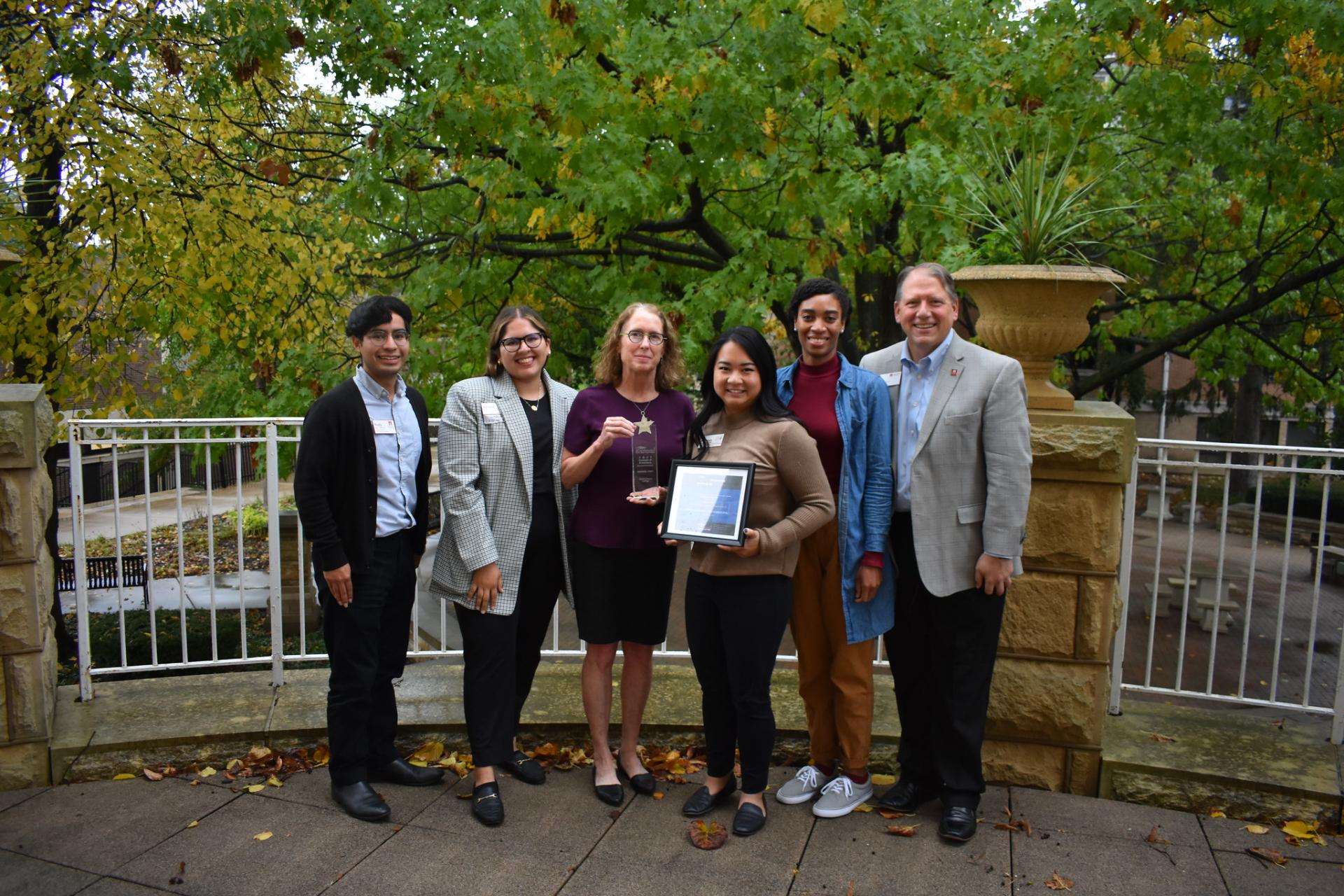 Cardinal First director Julie Carballo and President Troy Hammond with North Central College first-generation students.