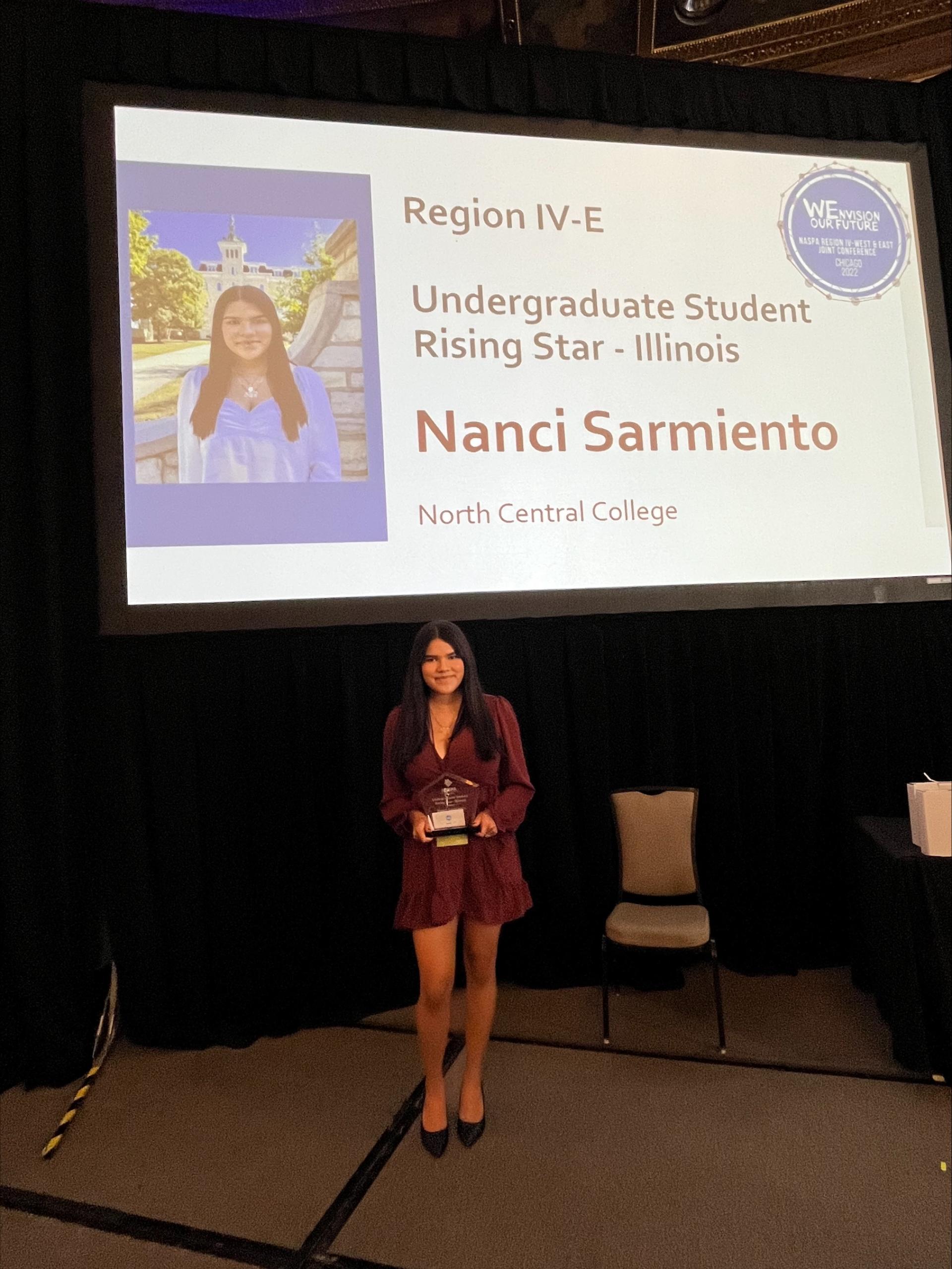 North Central College student Nanci Sarmiento accepts her NASPA Rising Star Award.