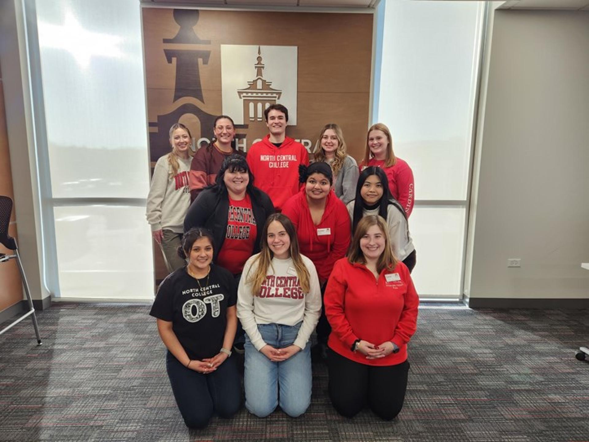 North Central College master of occupational therapy students work with children on their handwriting.