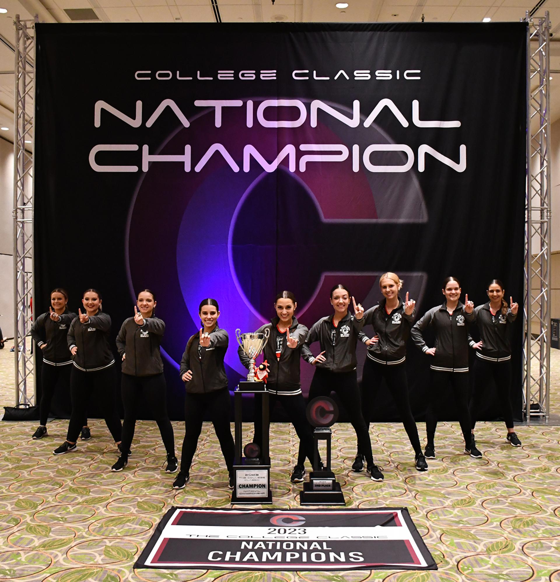 The North Central College dance team with their championship trophy.