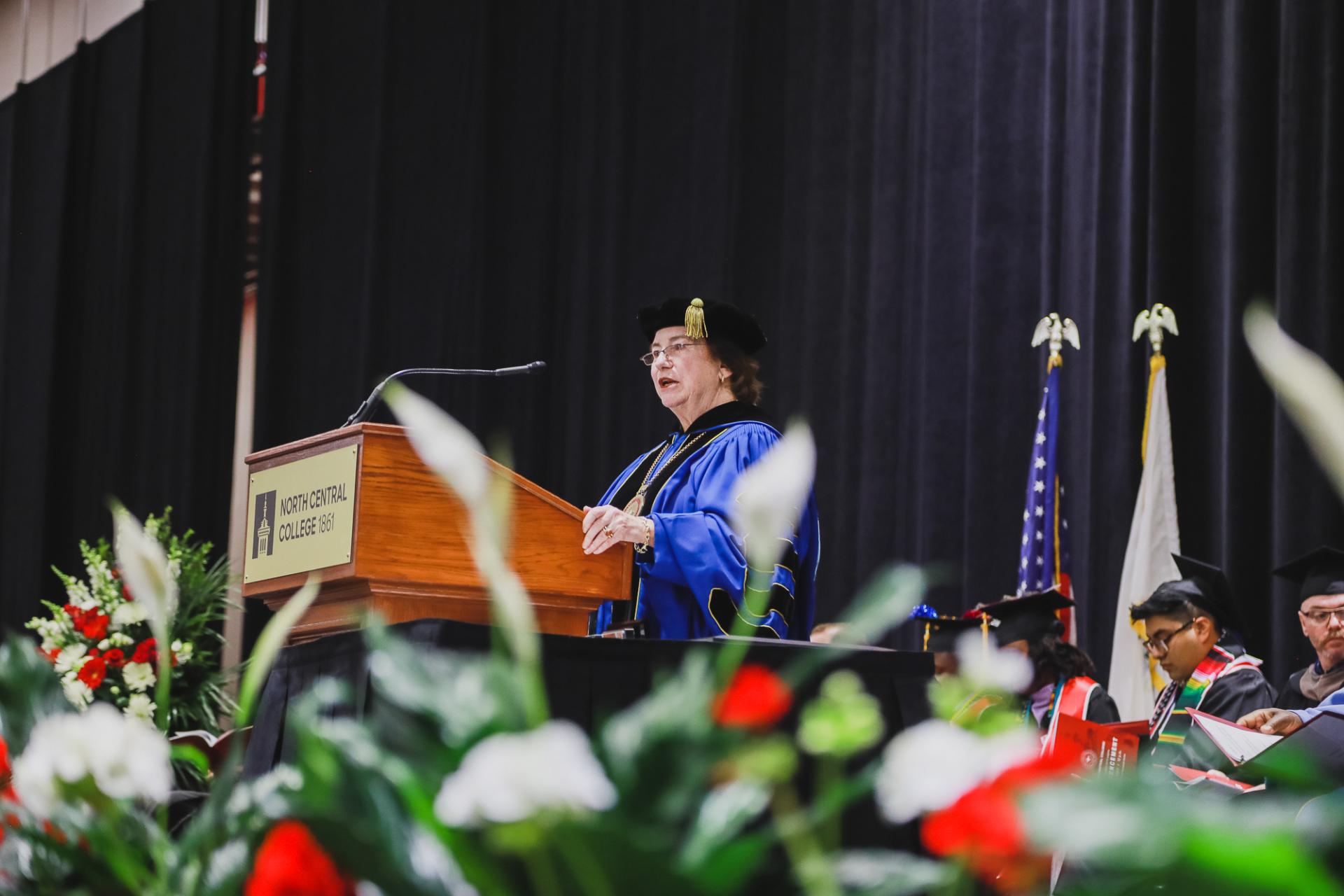 Interim President Donna Carroll welcomes the graduates.