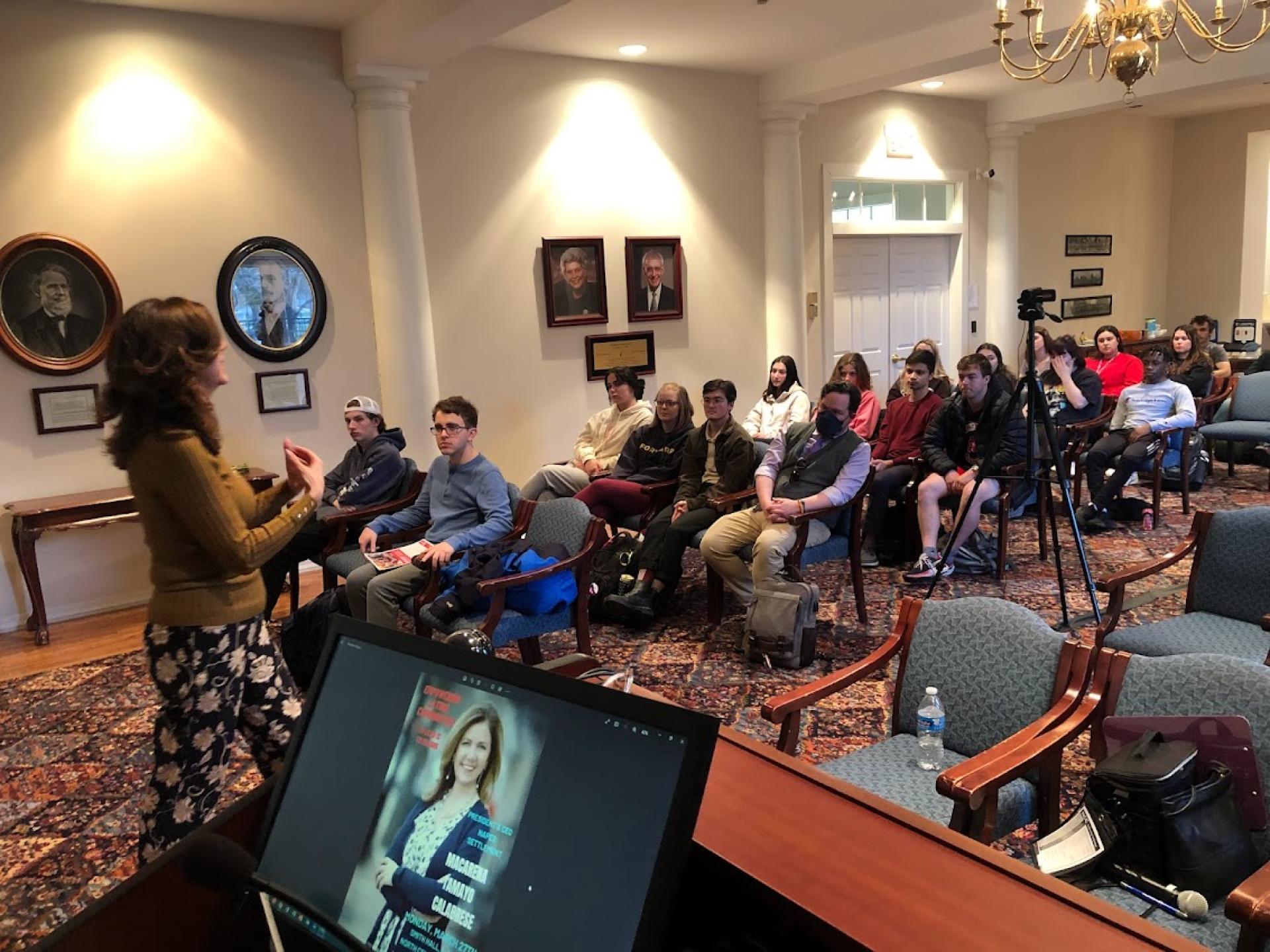 Macarena Tamayo-Calabrese leading a discussion with students.