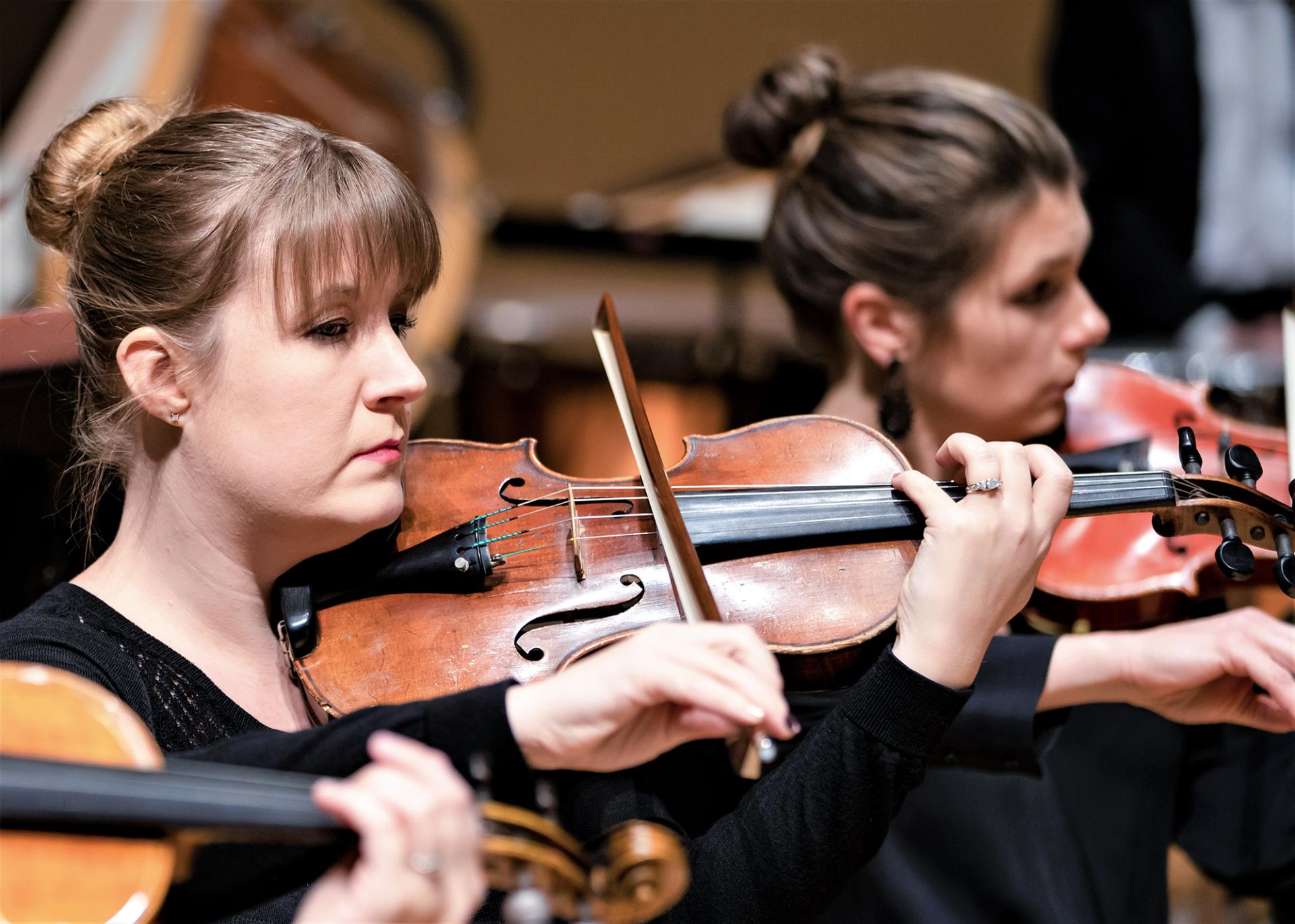 Violinists in the DuPage Symphony Orchestra.