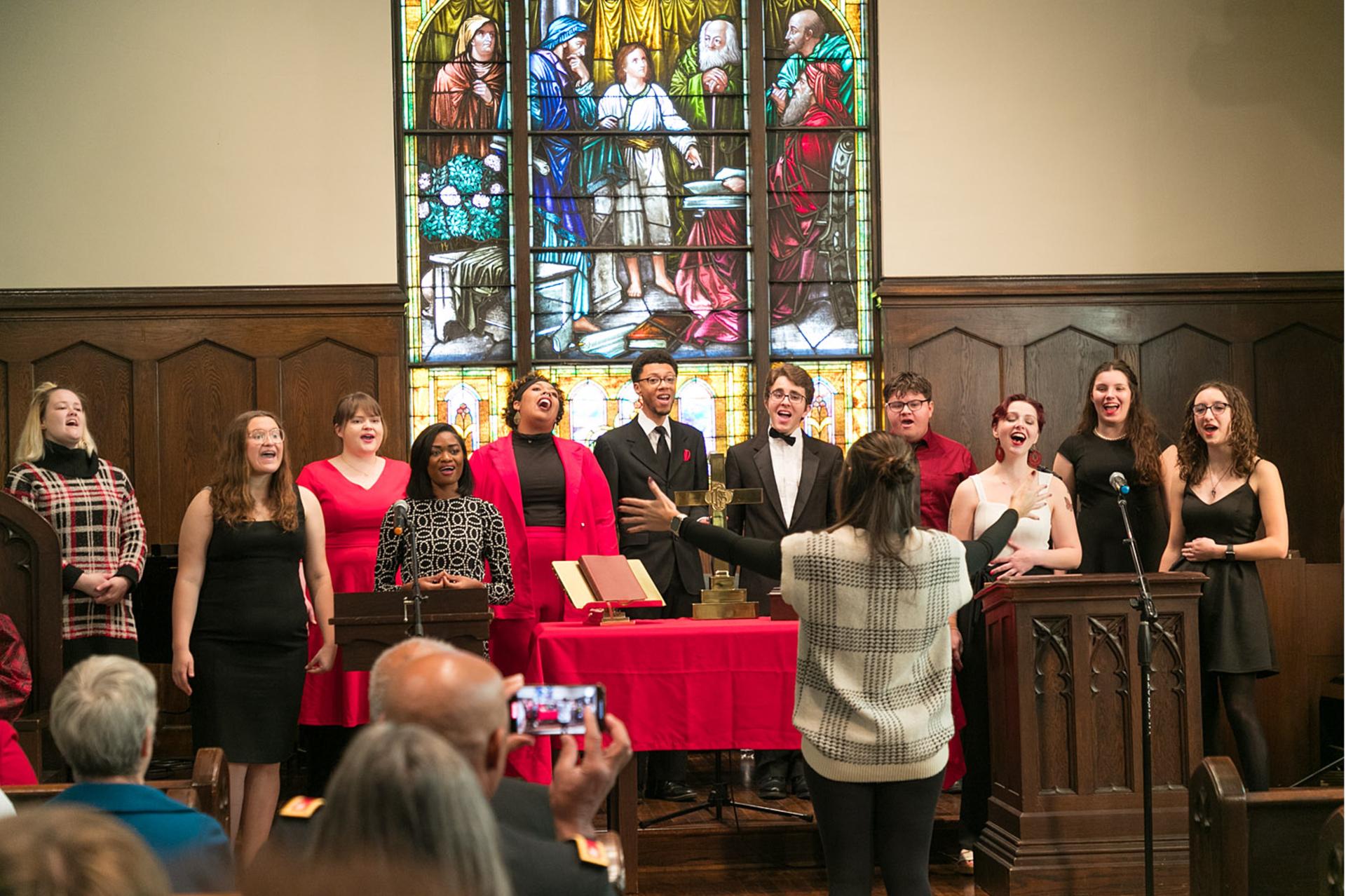 Voices of Praise singing at the worship service.