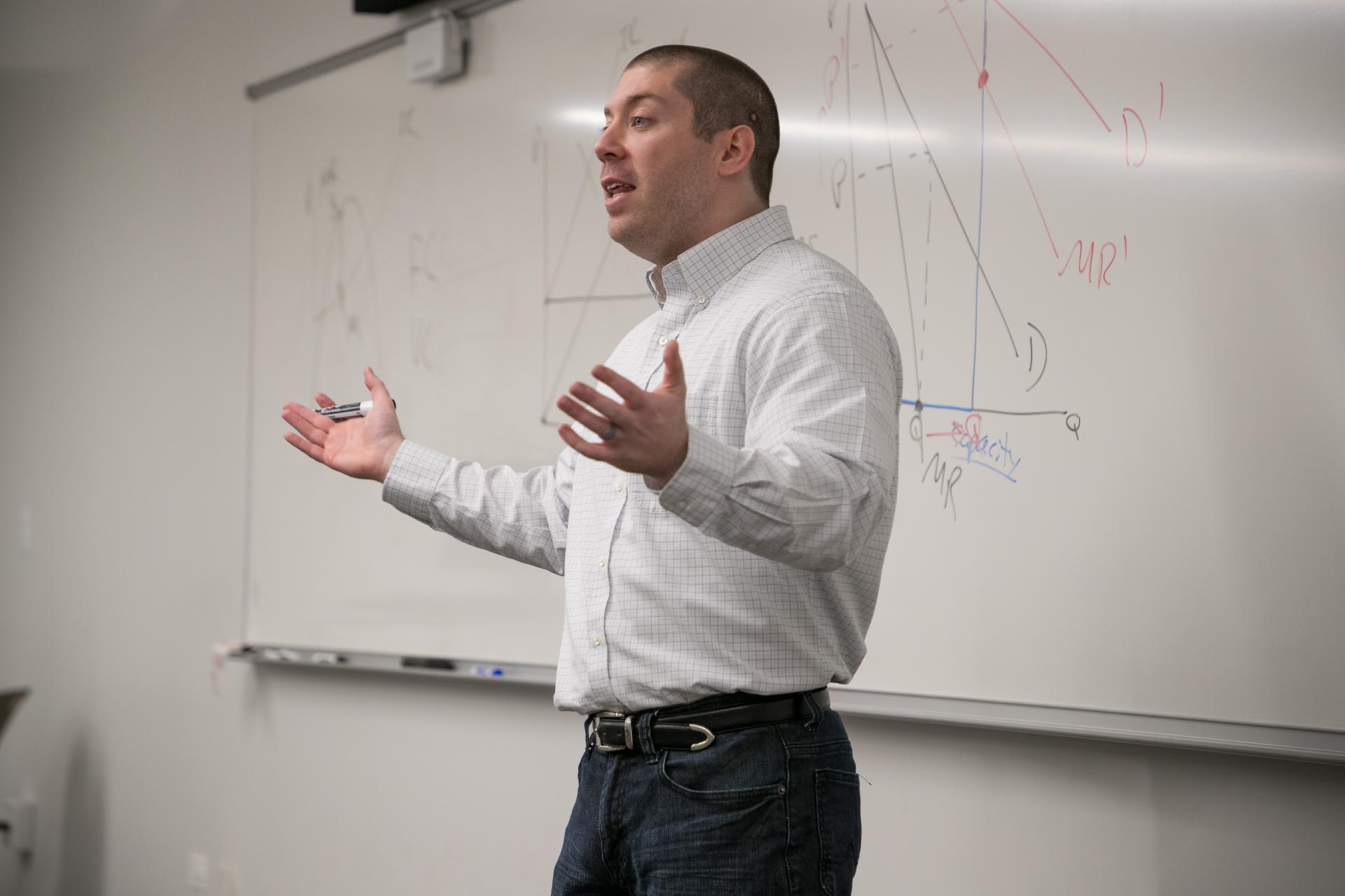 Ryan Decker teaching an economics course.