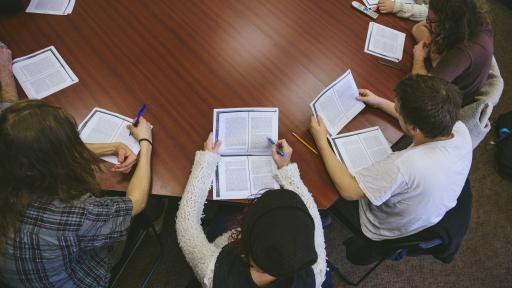 Shimer Students discussing an essay at a round table 