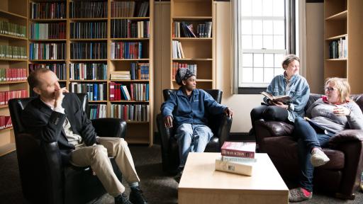 Shimer students and faculty sitting in lounge 