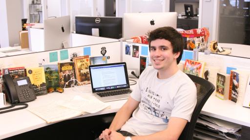 student intern at his desk