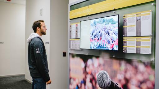 student looking at television in goldsphon hall 