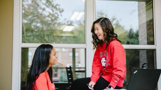 two students studying outside on central campus