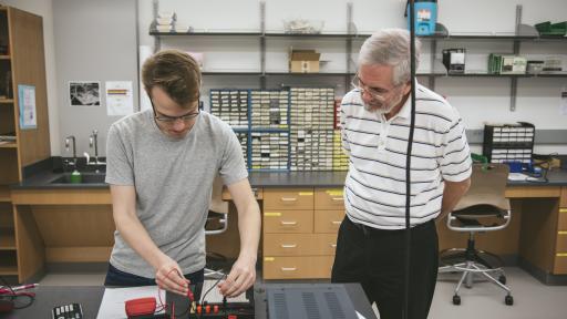 student and professor in lab