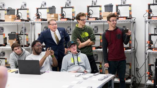 students and president in new engineering lab