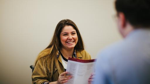 student and admission counselor talking