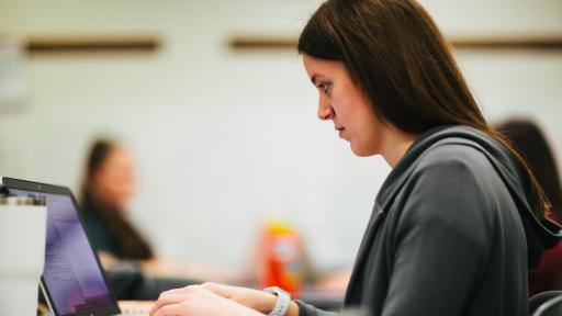 graduate student on laptop