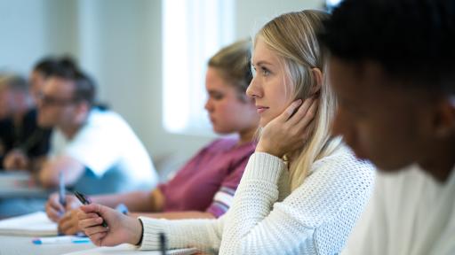 students in class taking notes