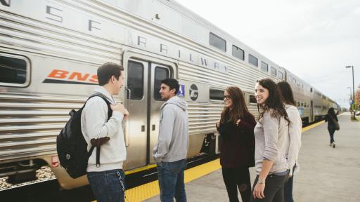 students by the train station