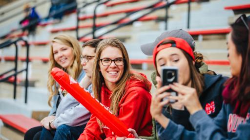 students at football game