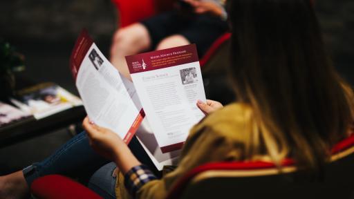 students looking at handout