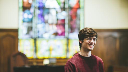 student in koten chapel