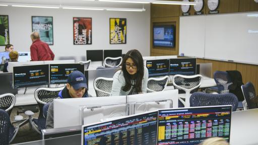 student and professor in bloomberg finance lab