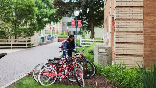 student with bikes on north central college campus