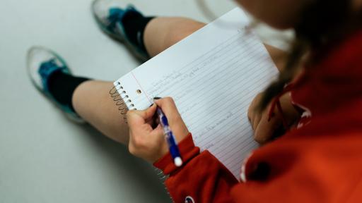 student taking notes