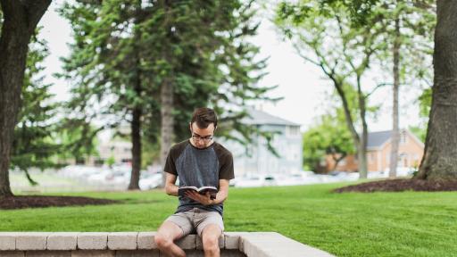 student sitting on campus