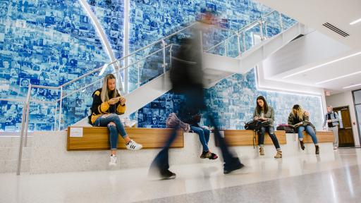 Students sitting by Golden Ratio Wall