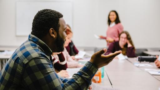 student speaking in class