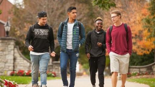 3 students walking on campus