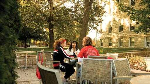 Students sitting outside at table