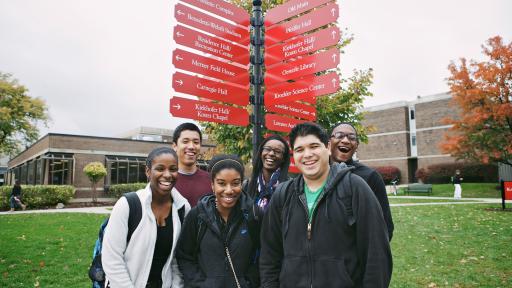 Students in front of sign