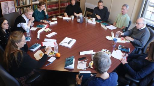 A Shimer Great Books School class in session around a round table.