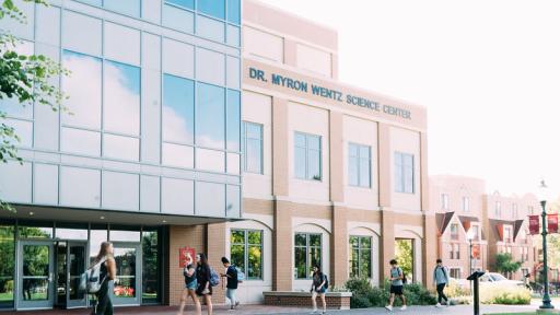 Students walking in front of Dr. Myron Wentz Science Center