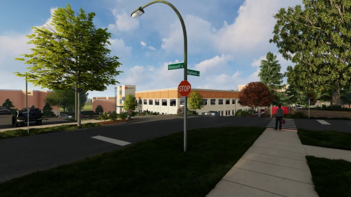 An image from the northeast corner of Brainard and Highland, looking southwest toward the parking pavilion, with the Highland lot and Res/Rec to the left and Merner Fieldhouse in the distance.