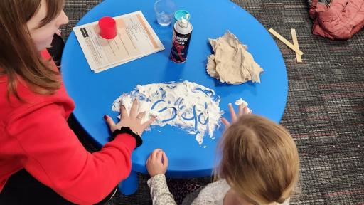 North Central occupational therapy students working with children on their handwriting.