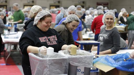 North Central College students packing meals at a Feed the Need event.