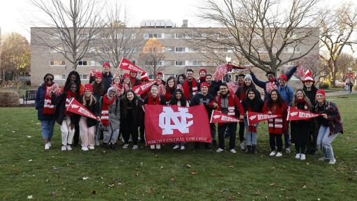 North Central College students holding a banner.